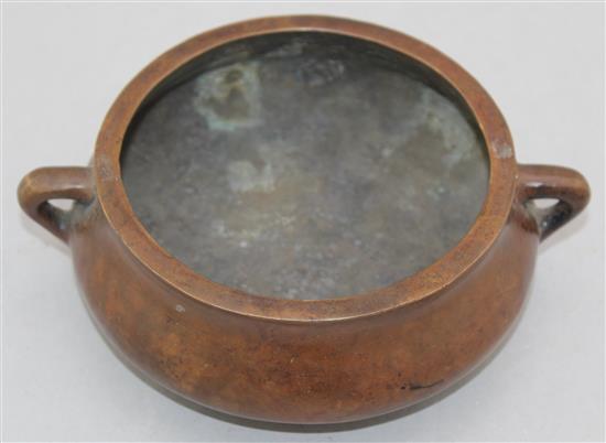 A Chinese bronze two handled censer, Gui, Xuande two character mark, 19cm.